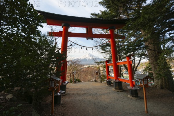 View through red torii of Mount Fuji volcano, Arakura Fuji Sengen Shrine, Arakurayama Sengen Park, Yamanashi Prefecture, Japan