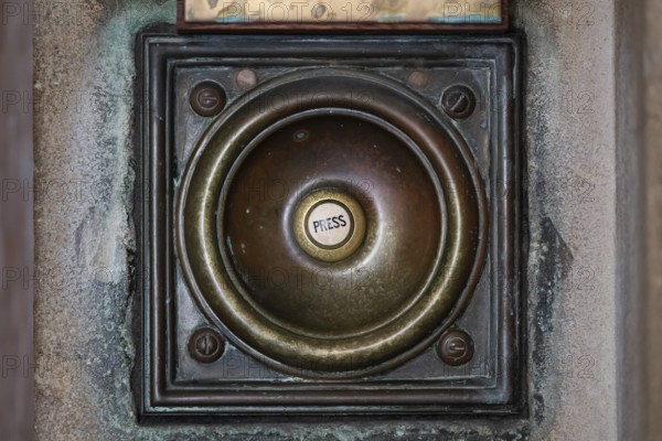 Bronze doorbell with patina and push button with the inscription press, urban and worn look, Royal Academy of Arts, Art Gallery and Academy of Arts, Burlington House, Piccadilly, London, England, Great Britain