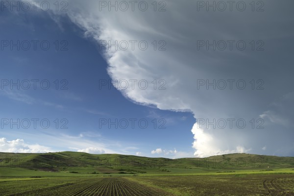 Landscape with approaching rain front (Nimbostratus), southern Carpathian Arc, Romania