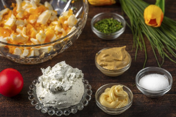 Ingredients for egg cream, such as cream cheese, sliced eggs and chives