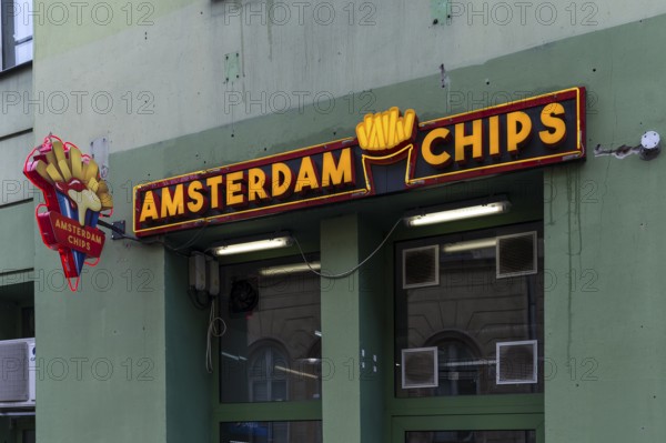 Illuminated advertising for chips, Krakow, Poland