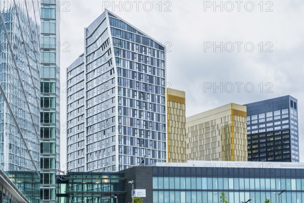 Modern high-rise office building in the European Quarter on the Kirchberg Plateau in Luxembourg City, Luxembourg. Contemporary corporate architecture photographed in daylight, featuring glass facade, clean geometric lines, and an urban business district atmosphere representing finance, administration, and modern city development