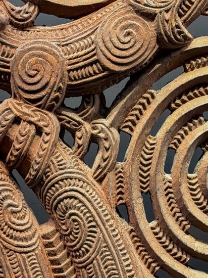Detail of a carving with artistic patterns, Maori art, Museum Five Continents, Bavaria, Germany