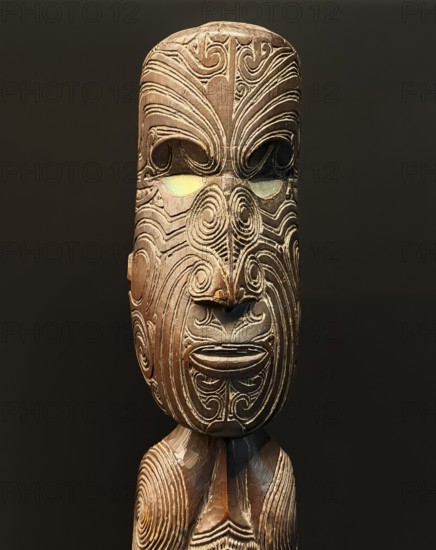 Carved wooden figure with artistic pattern, Maori art, Museum Five Continents, Bavaria, Germany