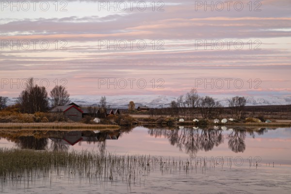 Early morning reflections in a secluded lake in Dovrefjell-Sunndalsfjella National Park, Norway