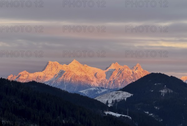 Alpine glow at sunset, mountain peaks of the Loferer Steinberge in winter, Kitzbühel Alps, Tyrol, Austria