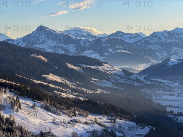 View of snowy valley and mountain landscape in morning light, Hochbrixen, Brixental and Kitzbühler Horn, Kitzbühler Alps, Tyrol, Austria