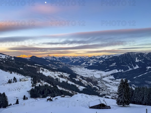 View of snowy valley and mountain landscape at sunset, Hochbrixen, Brixental, Kitzbühel Alps, Tyrol, Austria