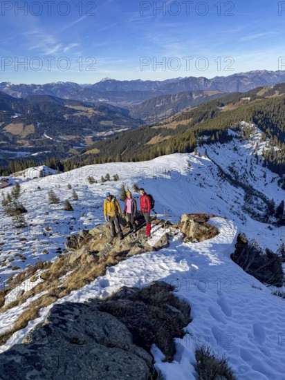 Three friends hiking trail to the summit of Feldalphorn, winter hiking, Kitzbühel Alps, Tyrol, Austria