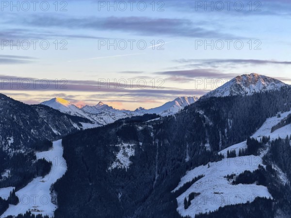 Alpine glow at sunset, Grossglockner mountain peak in winter, Brixental, Kitzbühel Alps, Tyrol, Austria