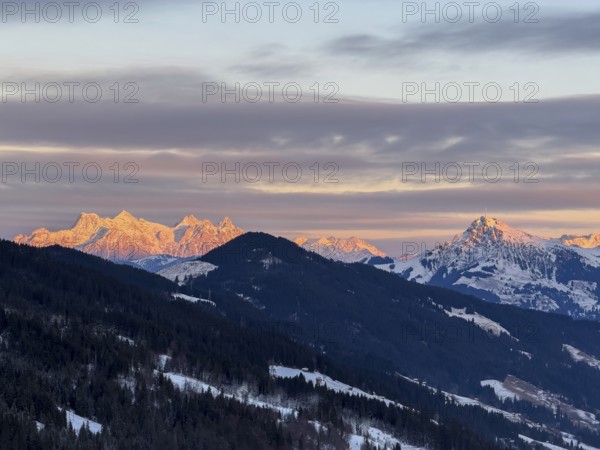 Alpine glow at sunset, mountain peaks of the Loferer Steinberge and Kitzbühler Horn in winter, Brixental, Kitzbühel Alps, Tyrol, Austria