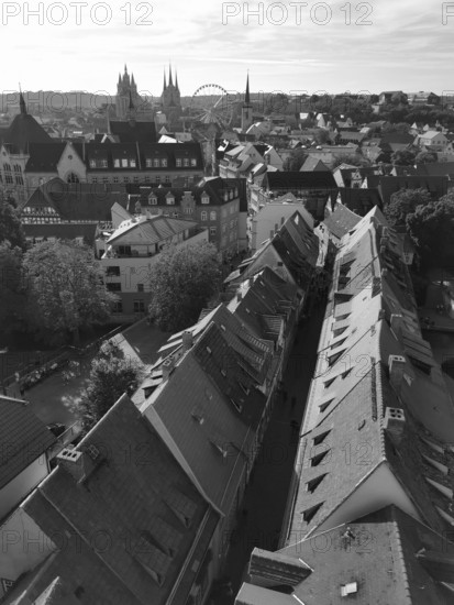 View of an old town with historic buildings, church towers and a Ferris wheel in the background, Erfurt, Thuringia