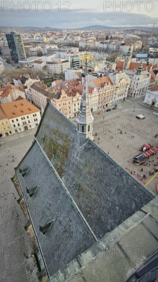 Bird's eye view of a town church with a distinctive tower and surrounding square, Pilsen, Czech Republic