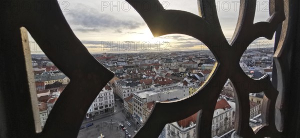 View through a decorated window of an urban landscape at sunset, Pilsen, Czech Republic