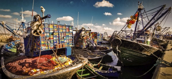 Colourful fishing boats in the harbor with numerous nets and ropes under clear skies, vivid colors, detailed atmosphere, Essaouira, Morocco