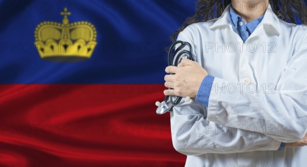 Healthcare professional with Liechtenstein flag background. Professional doctor holding stethoscope on Liechtenstein flag background