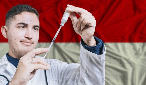 Doctor holding syringe on Indonesia flag background. Medical professional holding syringe with Indonesian flag in the background