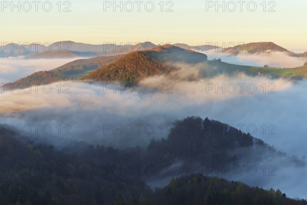 View from the Gisliflue of the Jura foothills covered in fog from the left, Wasserfluh, Summerholde, Asperstrihen, in the morning light, Talheim, Canton, Aargau, Switzerland