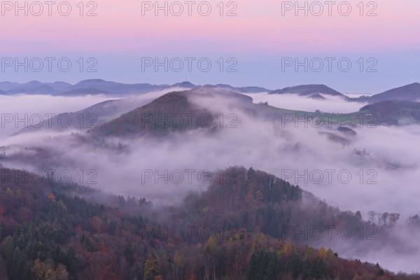 View from the Gisliflue of the Jurassic foothills covered in fog from the left, Wasserfluh, Summerholde, Asperstrihen, in the light of the rising sun, Talheim, Canton of Aargau, Switzerland