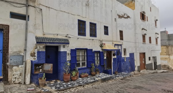 Charming building with white and blue accents in traditional neighborhood, southern Morocco