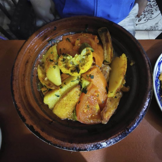 Traditional Moroccan tagine with mixed vegetables in a clay pot, Morocco