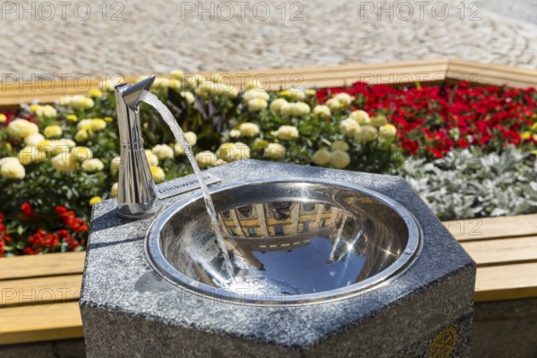 Drinking fountain on the main market square, reflecting the town hall, Bautzen, Upper Lusatia, Saxony, Germany