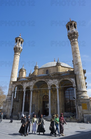 Historic mosque with distinctive minarets and people on the square in front of it, Aziziye Mosque, Ottoman period mosque, Konya, Central Anatolia, Turkey