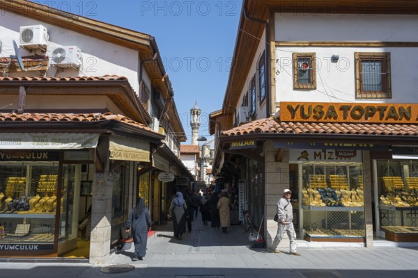 Lively market street with traditional shops and passers-by on a sunny day, jewelry shops, Konya, Central Anatolia, Turkey