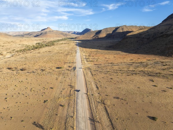 Aerial view, Eternally long straight road, road C14 through the Naukluft Mountains, desert and dry mountains, Namibia