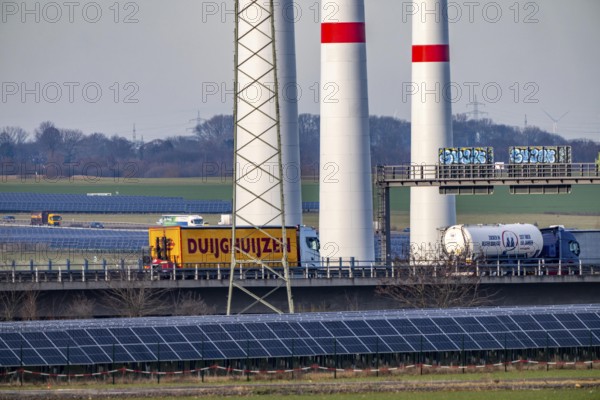 86.5 MW peak open space photovoltaic systems, from RWE, with over 141, 000 solar modules, on a side strip, over 1 km long, along the A44 motorway near Bedburg, at the Jackerath triangle, recultivated open-cast mining site, wind farm north of Titz, North Rhine-Westphalia, Germany