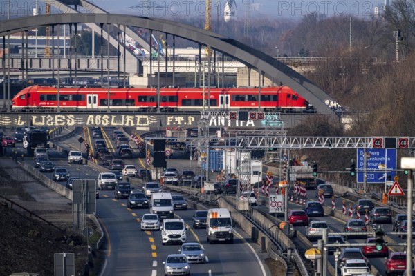 Traffic jam on the A43 motorway near Herne, heading north, in front of the barrier system, the vehicles heavier than 3.5 t stop and are then diverted, behind the barrier there is a dilapidated bridge across the Rhine-Herne Canal, which must be renewed, heavy vehicles must not pass through the bridge, railway bridges, public transport train, North Rhine-Westphalia, Germany