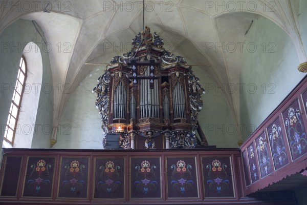 Gallery with baroque organ of the abandoned 16th century Protestant fortified church, Tobsdorf, Romanian Dupus, —Transylvania, Romania