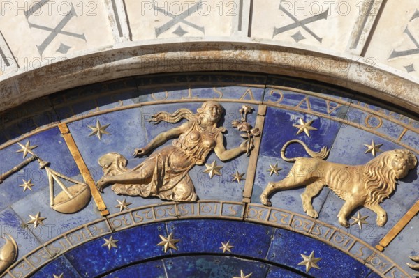 The astrological clock with moon phases and zodiac signs and lapis lazuli dial, in St. Mark's Square, Venice, Veneto, Italy