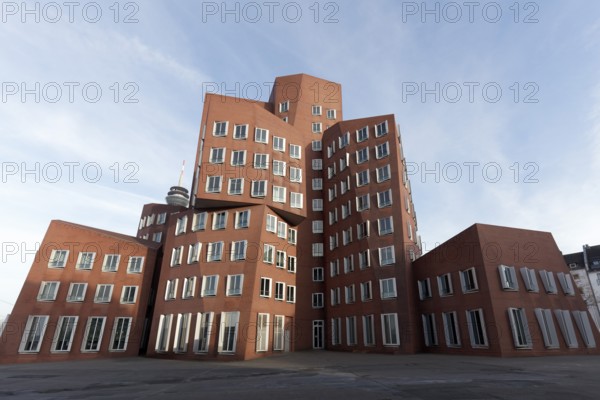 New Zollhof by architect Frank O. Gehry, red house with brick façade, Gehry buildings in the Deconstructivist style, Düsseldorf, North Rhine-Westphalia, Germany