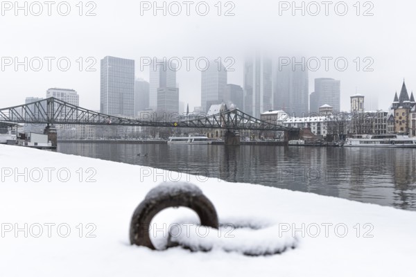 Clouds envelop Frankfurt's banking skyline. Heavy snowfalls have caused another onset of winter in the Main metropolis, Osthafen, Frankfurt am Main, Hesse, Germany