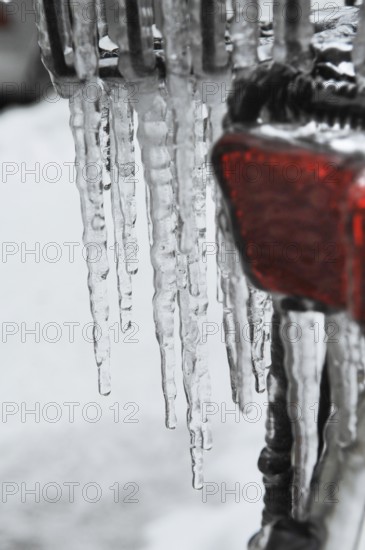 Bicycle icy due to freezing rain, icicles, detailed view