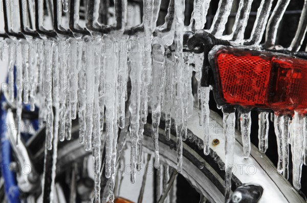 Bicycle icy due to freezing rain, icicles, detailed view