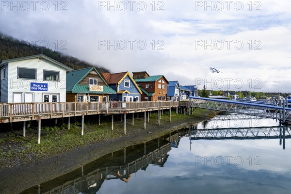 Colourful houses on the harbor, with reflection, Seward, Kenai Peninsula, Alaska, USA