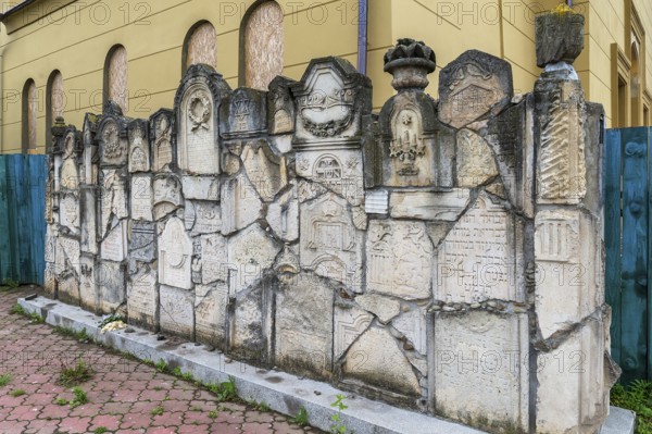Wall of Memory, constructing fragments of destroyed tombstones, Jewish cemetery, since 1866, Chernivtsi, Bukovina, Ukraine