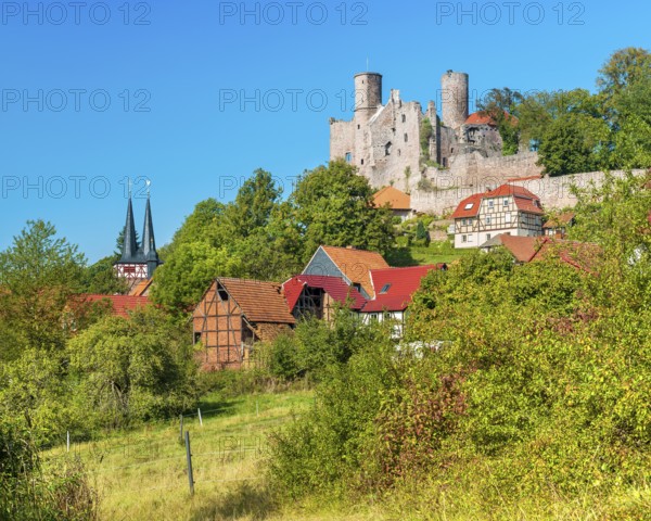 View of the ruins of Hanstein Castle and the small village of Rimbach, half-timbered houses and village church with half-timbered towers, Bornhagen, Eichsfeld, Thuringia, Germany