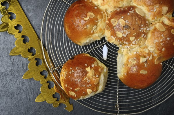 Epiphany cake with paper crown and king, Switzerland