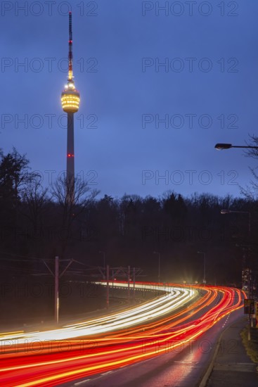 The television tower is the landmark of the state capital Stuttgart. The pulpit is illuminated in the evening. Before that, there are traces of light from vehicles. The SWR TV Tower is celebrating its 70th anniversary in 2026. Stuttgart, Baden-Württemberg, Germany