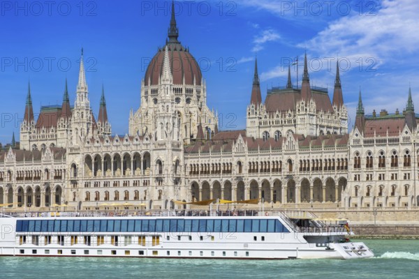 Hungary, boat cruise on Danube River near Budapest Parliament. Panoramic view of city skyline of Budapest historic center