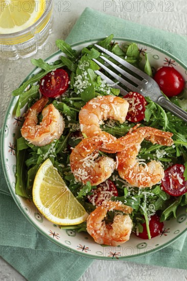 Shrimp salad with arugula and cherry tomatoes, with parmesan cheese, healthy food