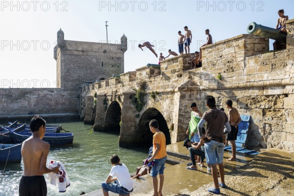 Children playing on the promenade, Essaouira, UNESCO World Heritage Site, Atlantic coast, Morocco