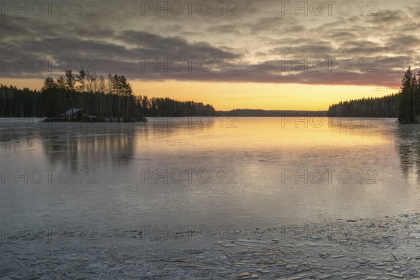 Ice formation on the shore of a lake, forest, sunrise, winter, Hartola, Finland