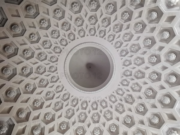 Geometrically decorated dome ceiling with symmetrical pattern and classic decorations, Warsaw, Poland