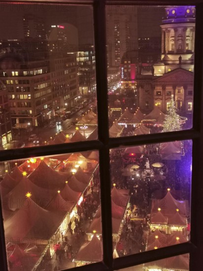 View of an illuminated Christmas market in the city at night, Gendarmenmarkt, Berlin