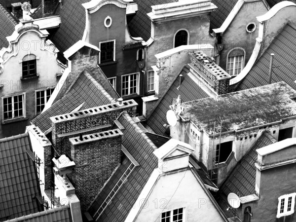 Closely standing roofs and facades of historic urban architecture, Gdansk, Poland