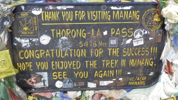 Trekking sign in Nepal at Thorong-La Pass with welcome messages